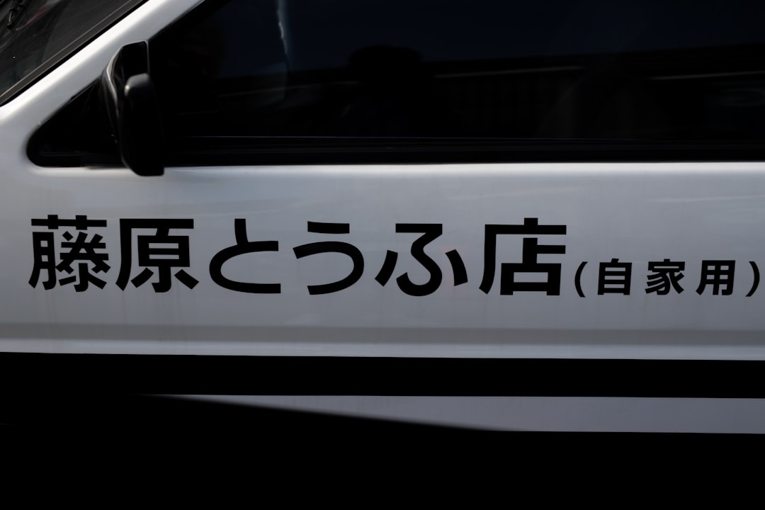 white and black car with license plate,