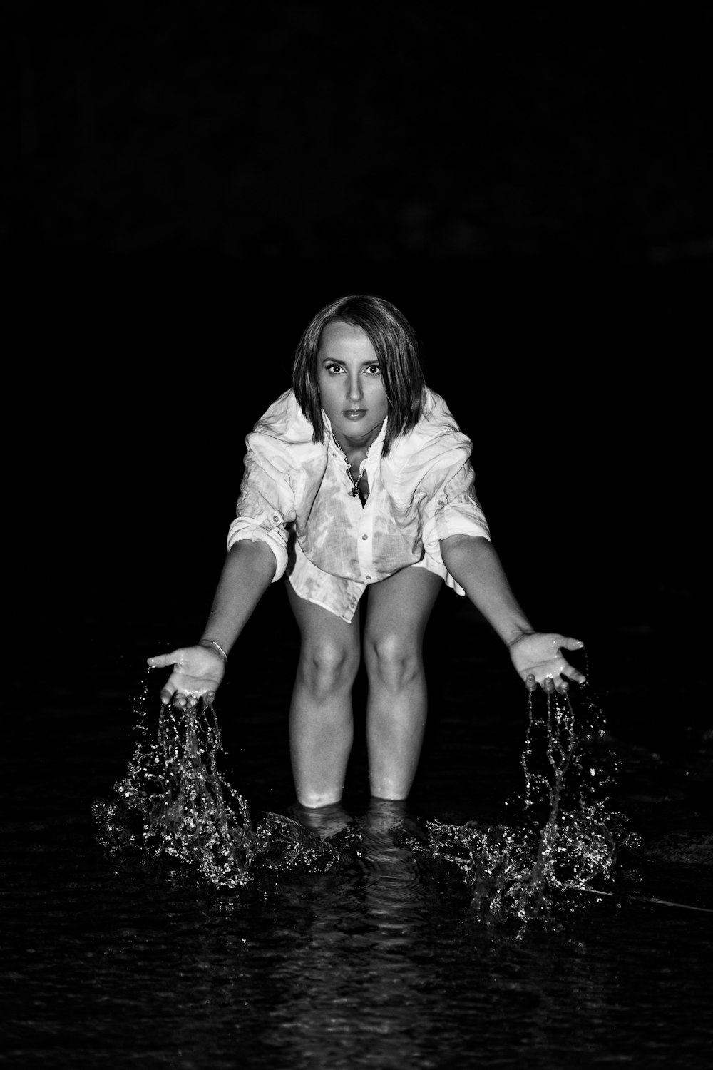 girl in white dress shirt on water