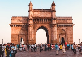 people walking on arch gate during daytime