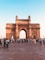 people walking on arch gate during daytime