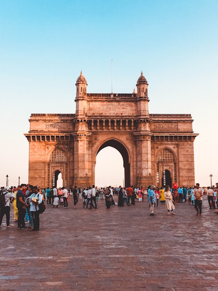 people walking on arch gate during daytime
