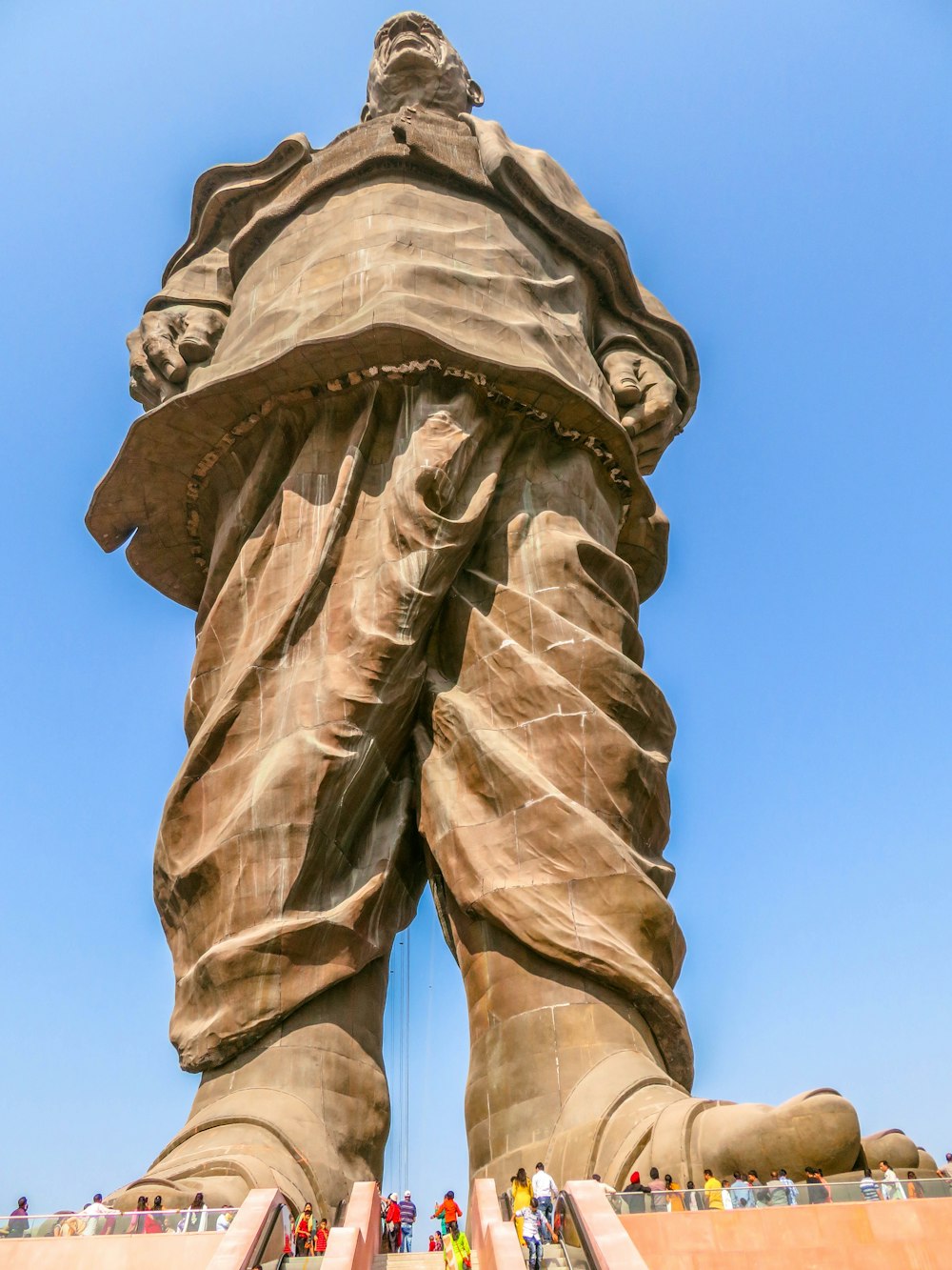 brown concrete statue under blue sky during daytime