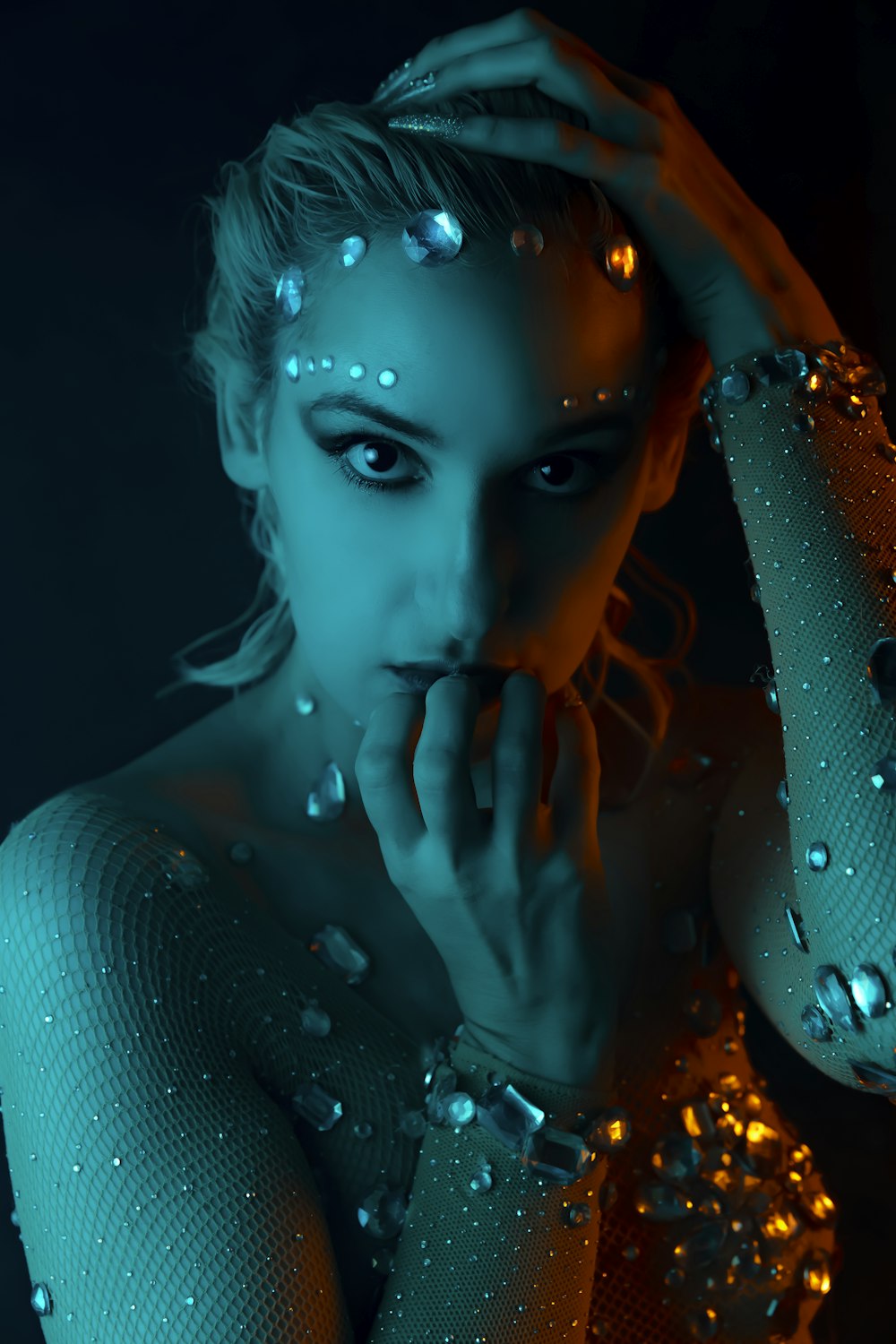 woman in white tank top with water droplets