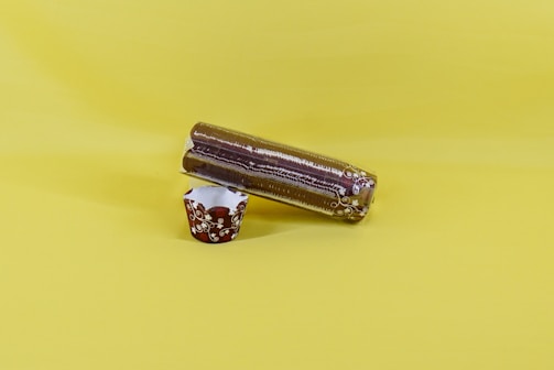 Close-up of a stack of sturdy, transparent plastic cups with the Dulaplast logo subtly embossed.