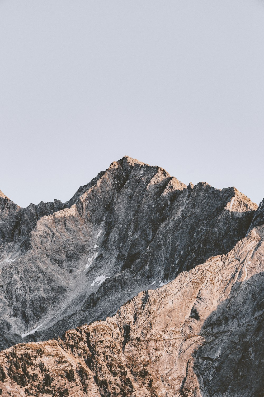 brown rocky mountain under white sky during daytime