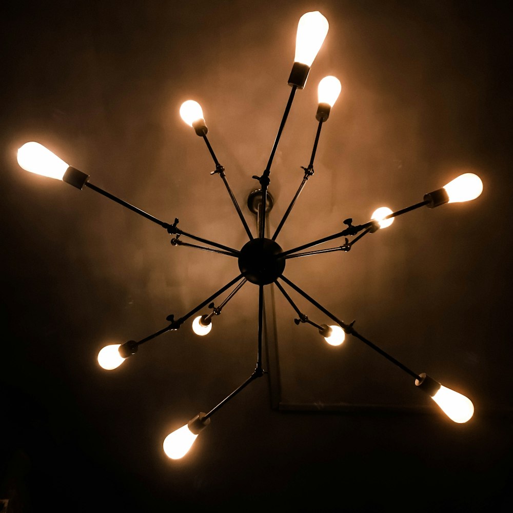 a chandelier with a bunch of lights hanging from it