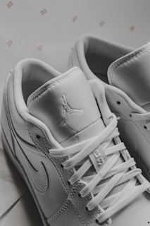 Close-up of stylish sneakers and accessories on display.