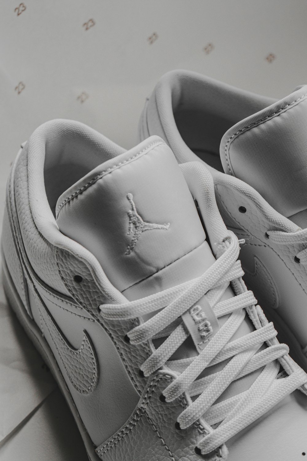 white and red nike athletic shoes photo – Free Grey Image on Unsplash
