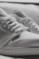 Close-up of textured PU material highlighting shoe details.