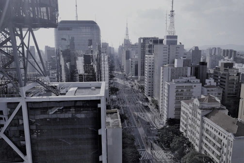 Wide shot of a busy cityscape with visible network cables and antennas.