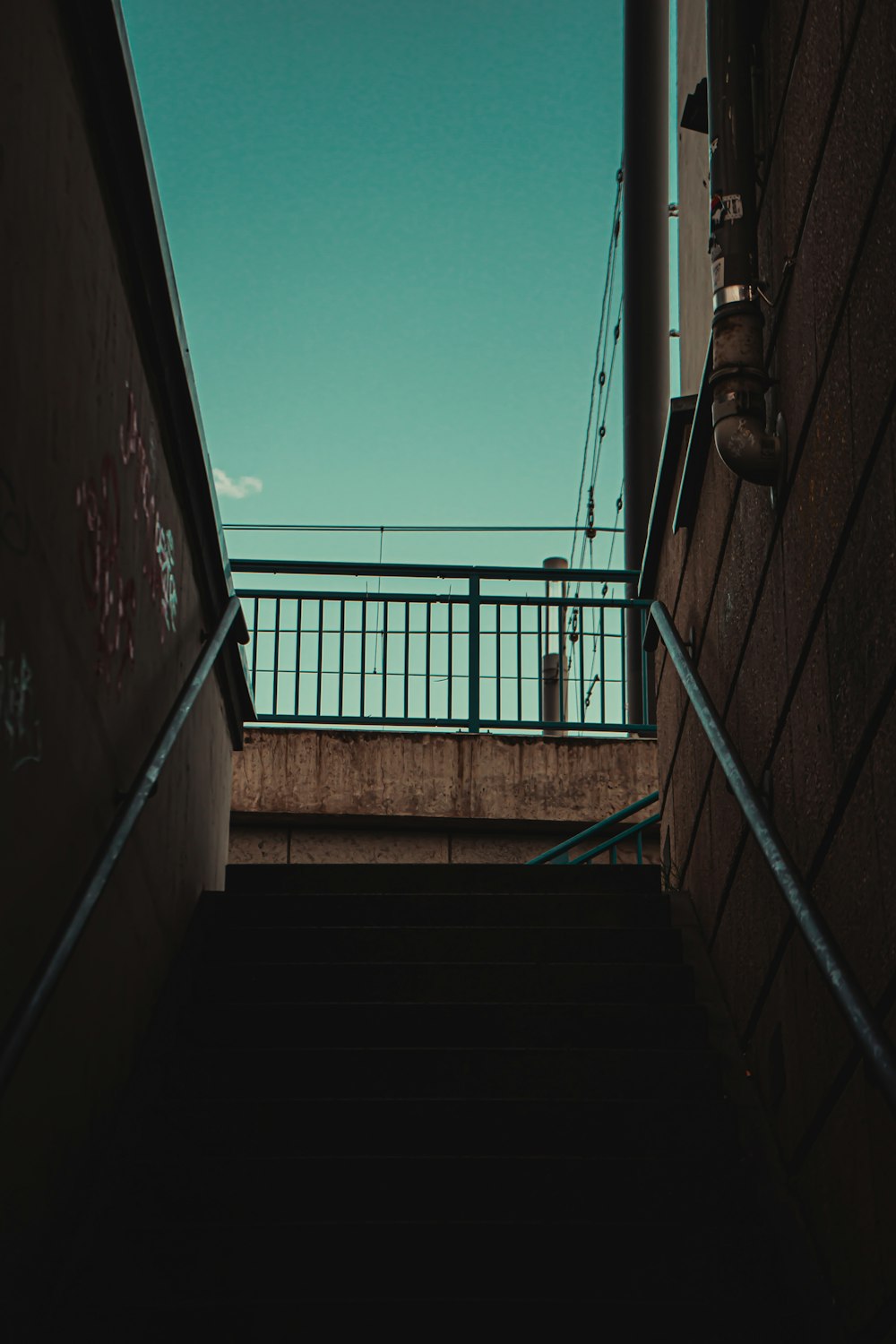 black steel railings on brown concrete staircase during daytime