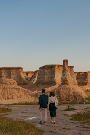 A couple hiking together in a beautiful landscape.
