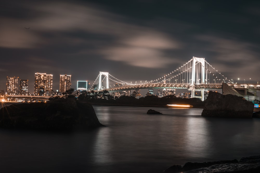 bridge over water during night time