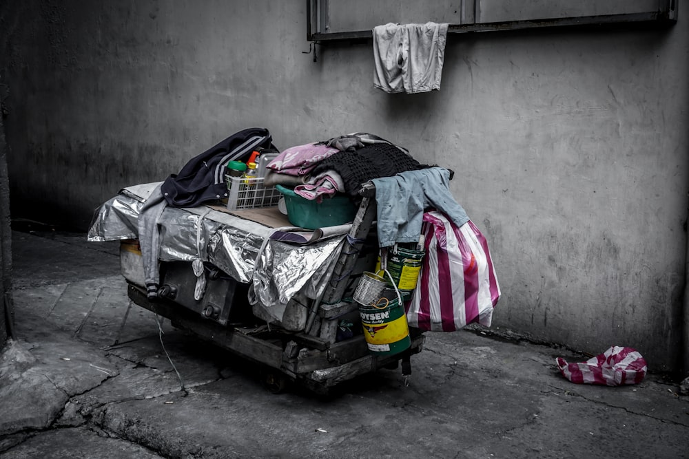 assorted clothes on black steel rack