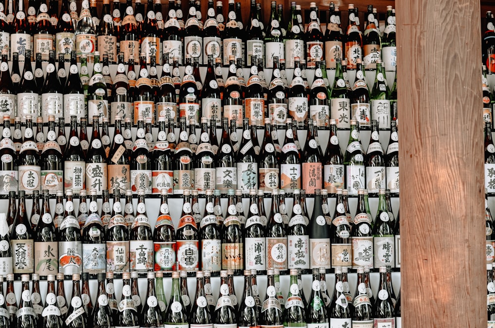 brown glass bottle on brown wooden shelf