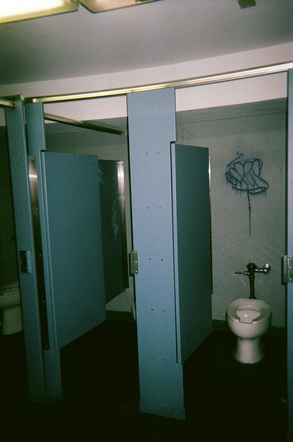 white ceramic sink near blue wooden door