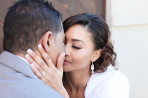Casual chic moment featuring a man and woman both wearing subtle, stylish earrings from the collection