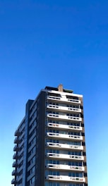 A vibrant photo showing a modern residential building in Lagos under a clear blue sky.