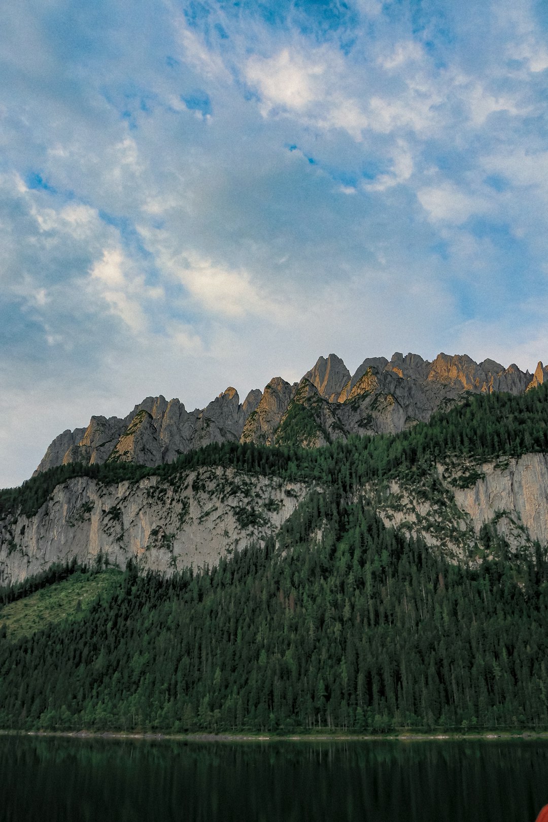 green trees on mountain under blue sky during daytime