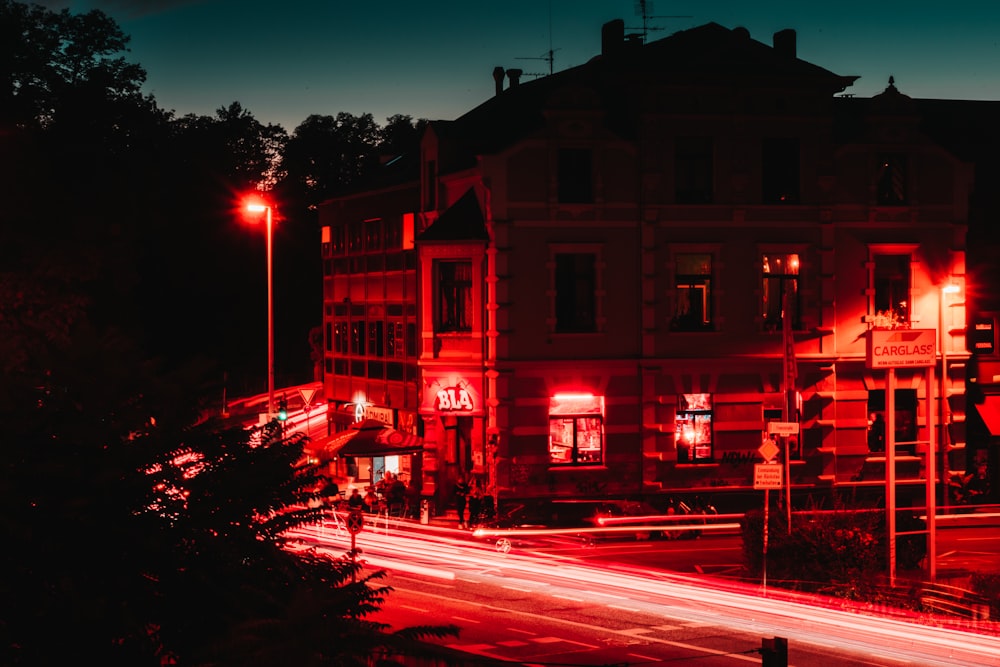 red and white concrete building during night time