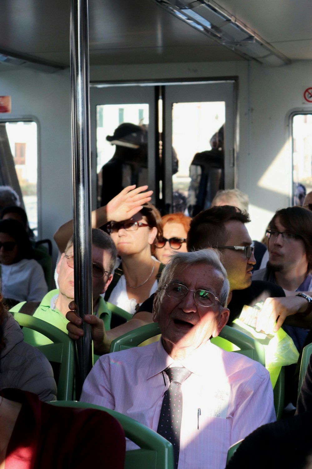 people sitting inside train during daytime