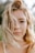 woman with blonde hair and brown eyes