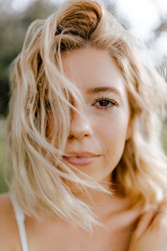 woman with blonde hair and brown eyes