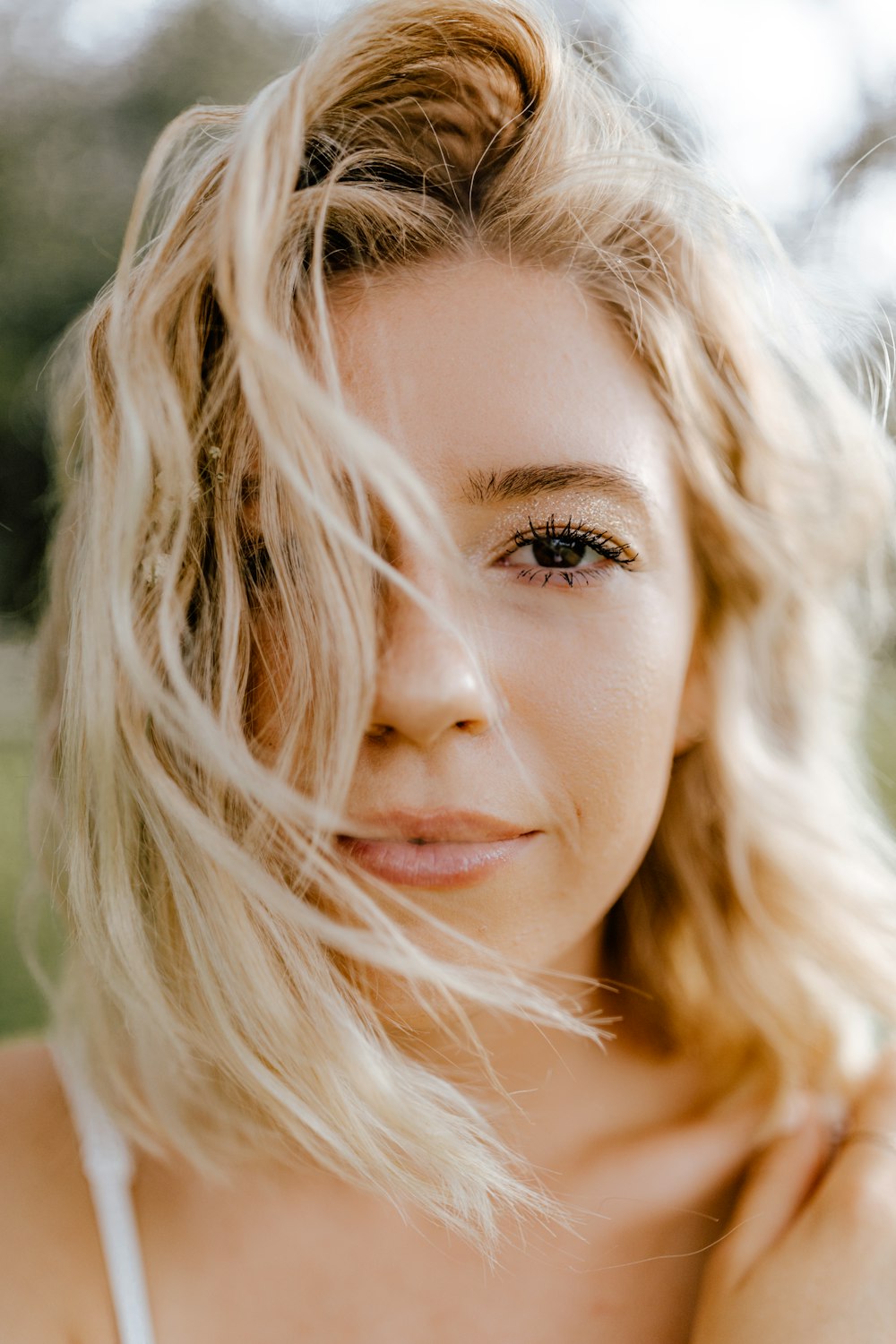 woman with blonde hair and brown eyes