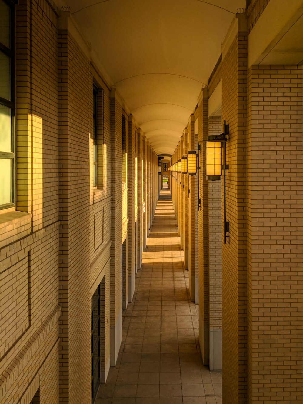 white and brown hallway with glass windows