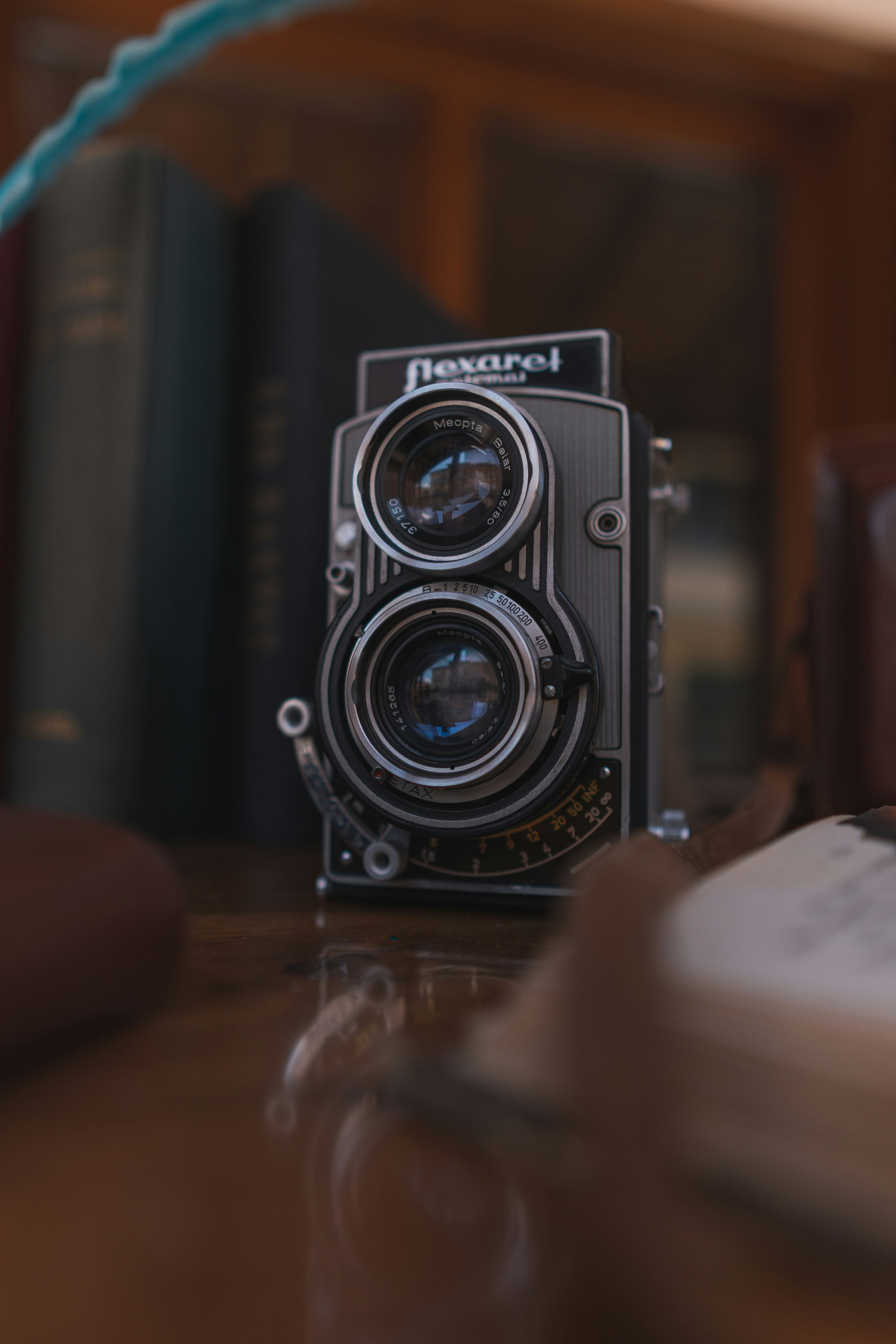 black nikon dslr camera on brown wooden table