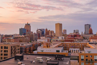 Modern Adelaide skyline at sunset, highlighting residential buildings and peaceful neighborhoods.