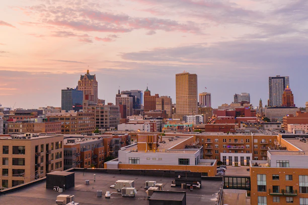 Modern Adelaide skyline at sunset, highlighting residential buildings and peaceful neighborhoods.