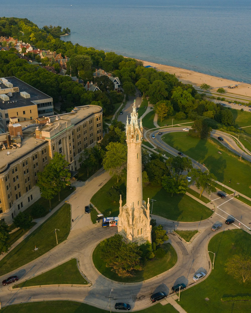 aerial view of green grass field near body of water during daytime