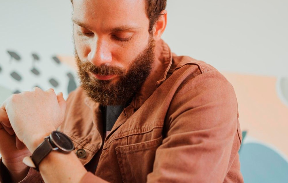 man in brown button up shirt wearing black sunglasses