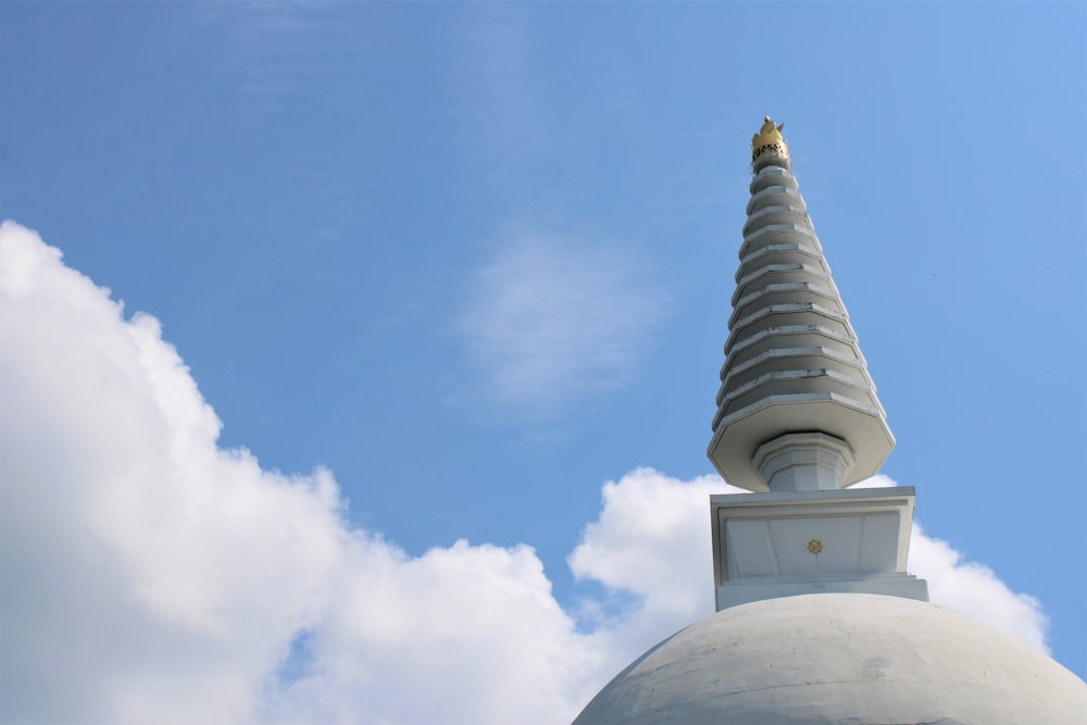 white clouds over white concrete building