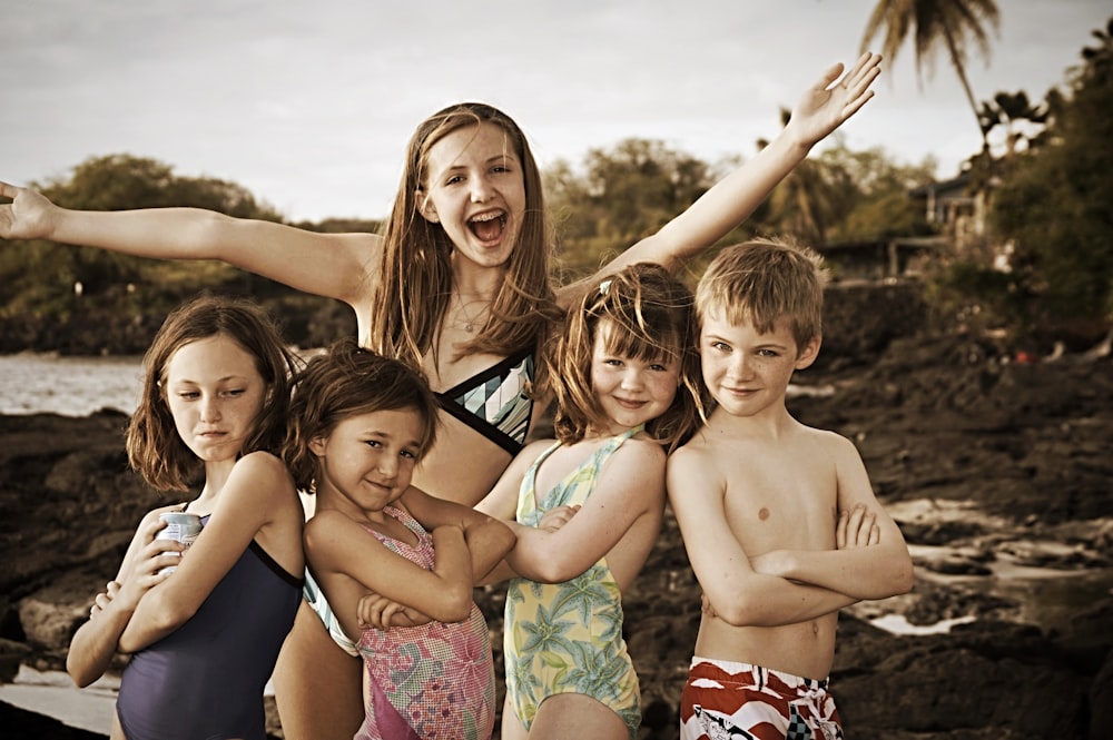 3 girls in bikini posing for photo