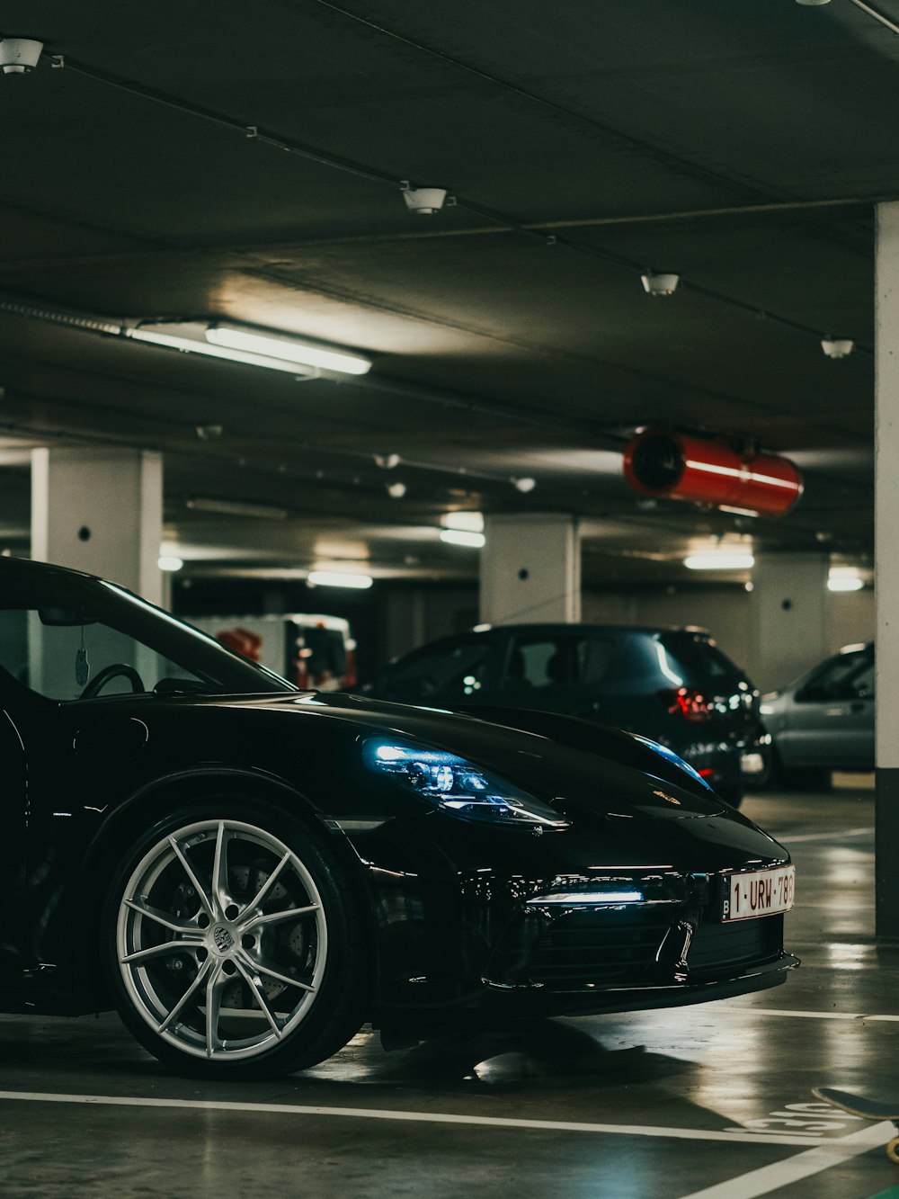 black porsche 911 parked in garage