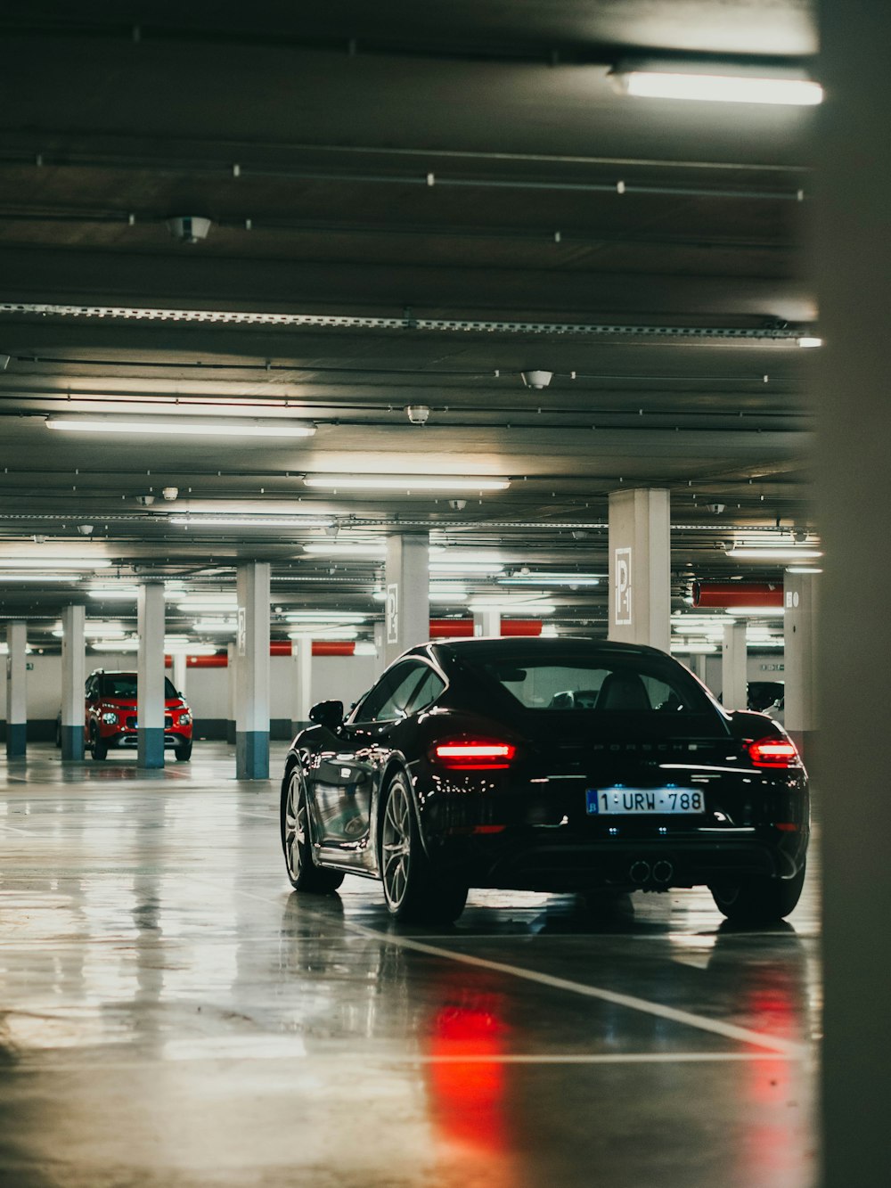 black porsche 911 parked inside building