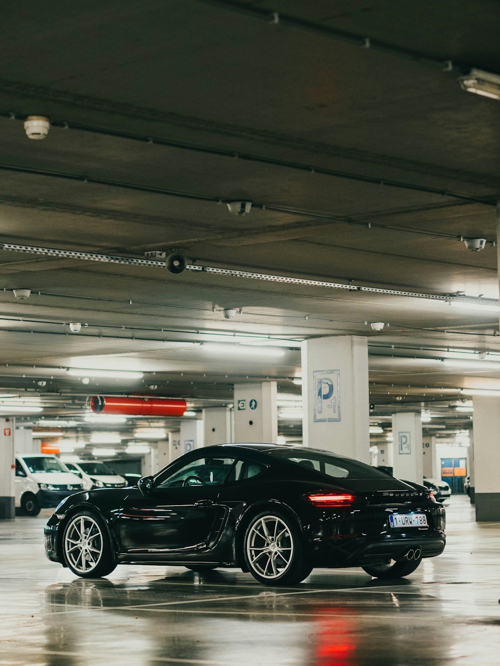 black coupe in a parking lot