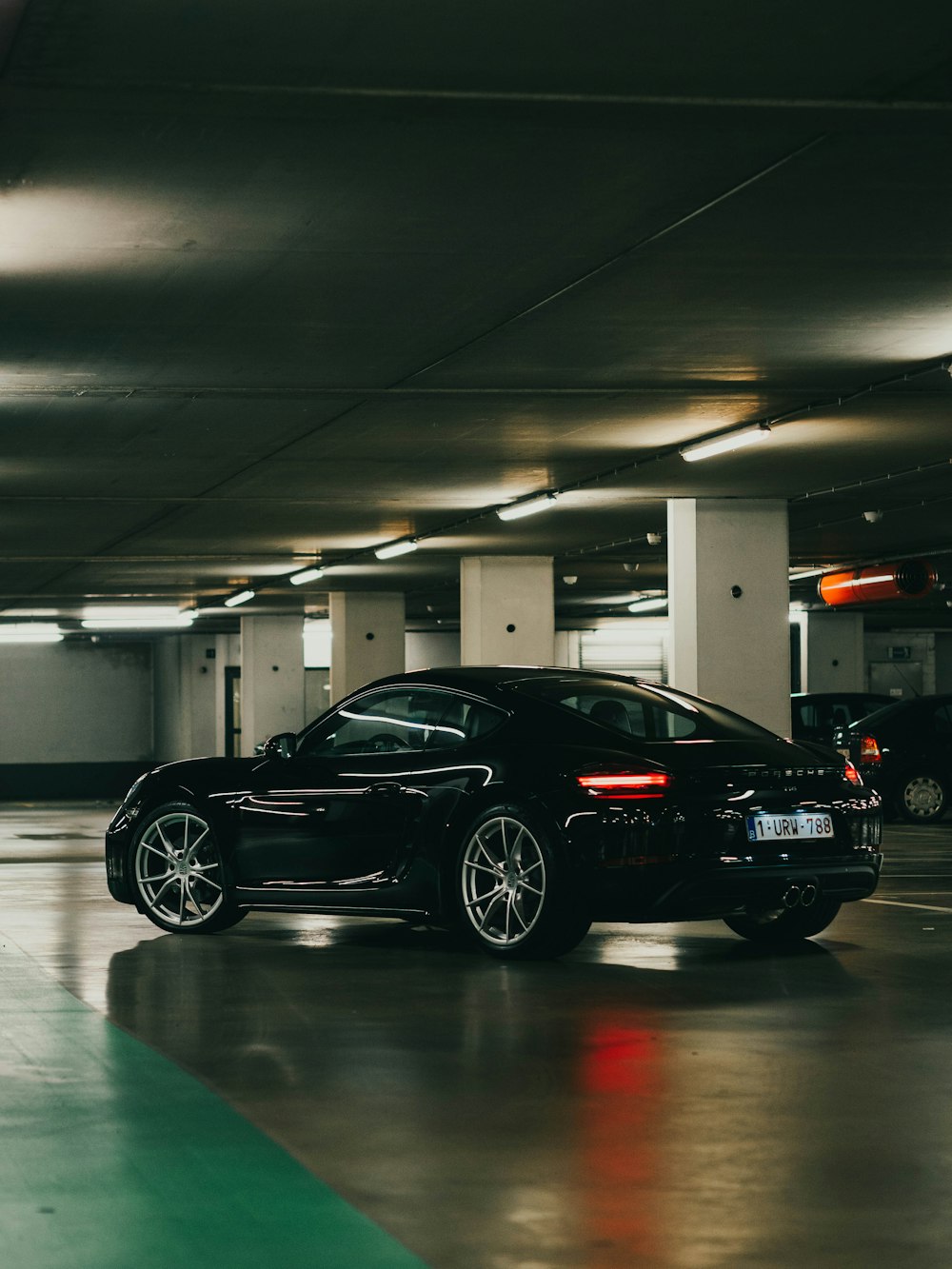 black coupe parked inside building