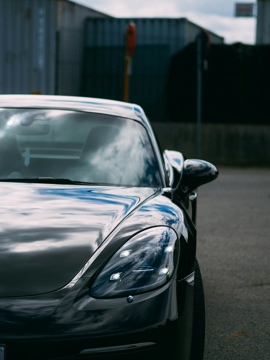 black car on gray asphalt road during daytime