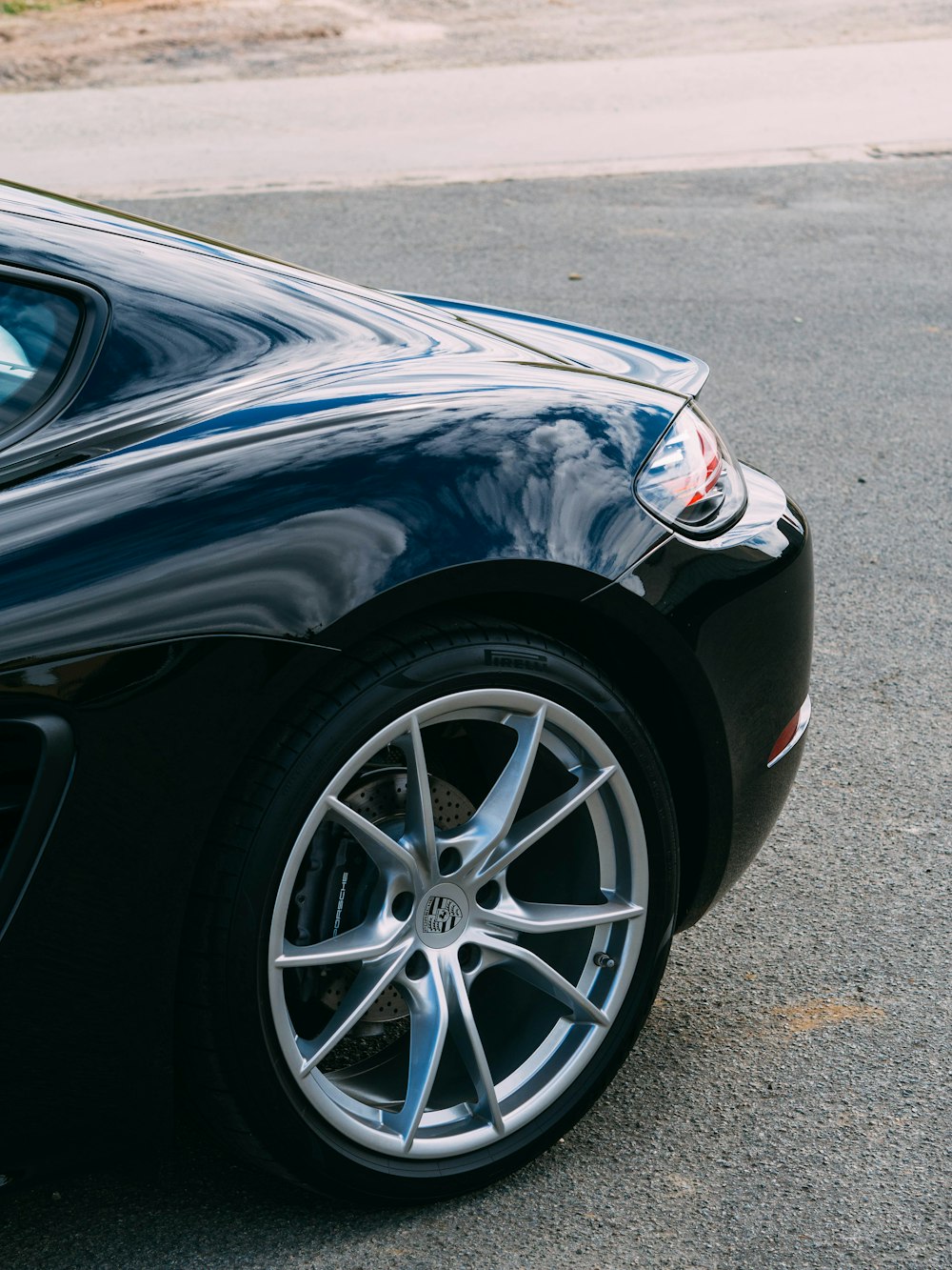 black car on gray asphalt road during daytime