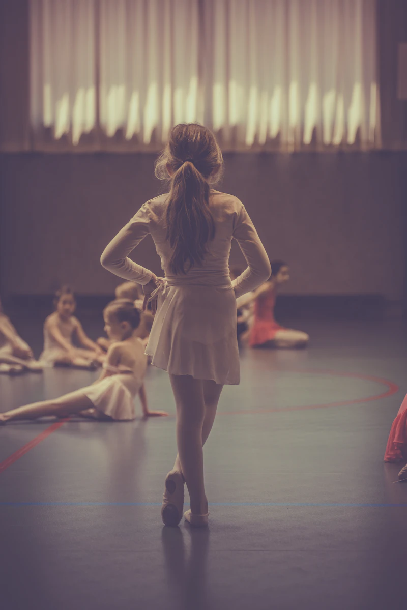 Dancers laughing together during a group class
