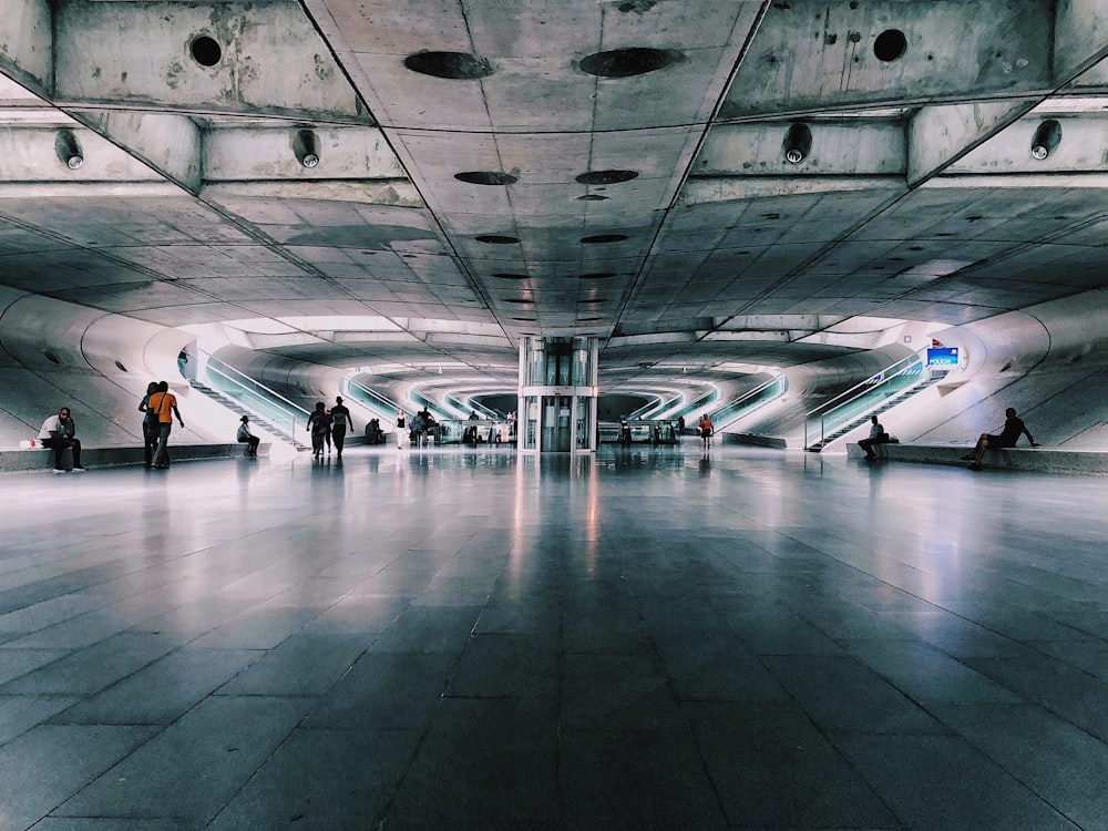 people walking on gray concrete floor