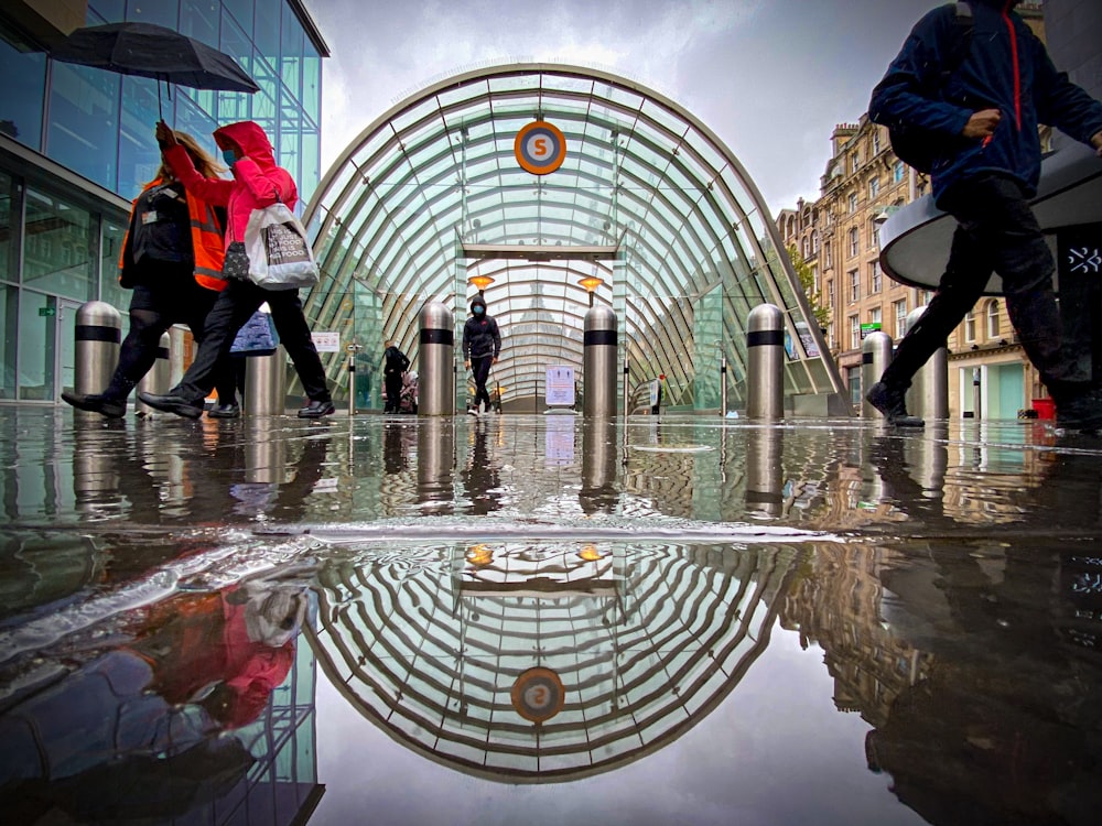 people walking on water fountain