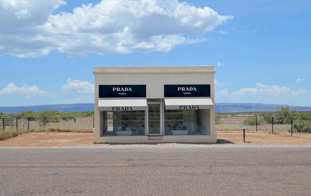 a couple of buildings sitting on the side of a road