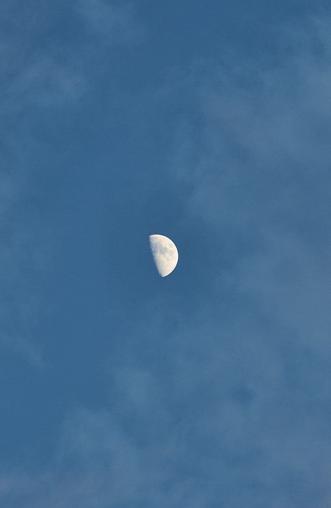 half moon in blue sky