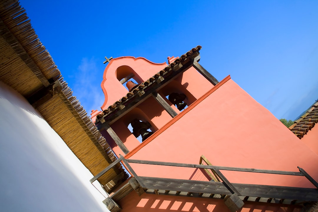 brown concrete building under blue sky during daytime