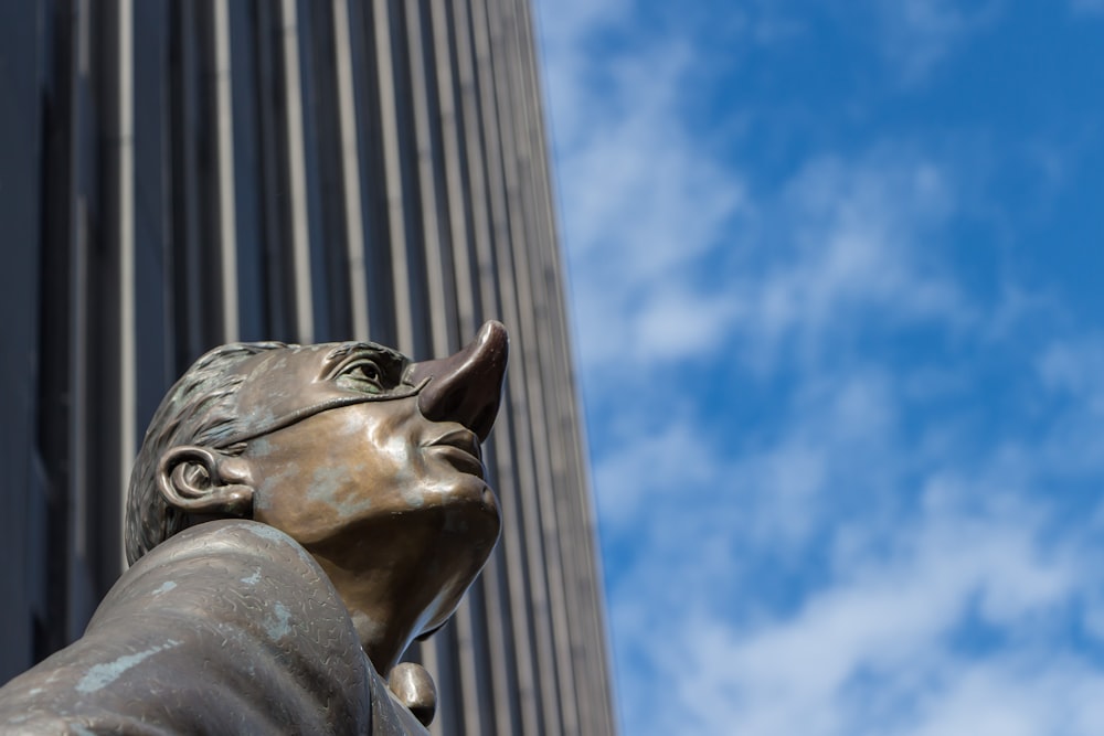 grey concrete statue under blue sky during daytime