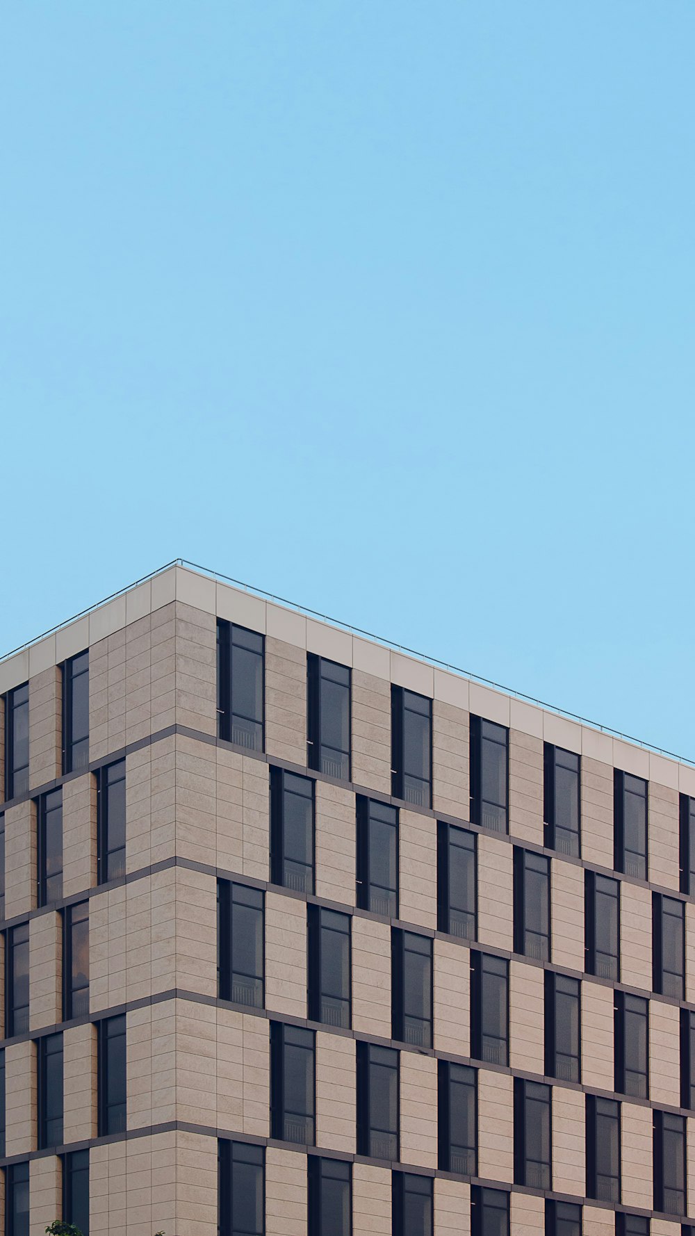 brown concrete building under blue sky during daytime